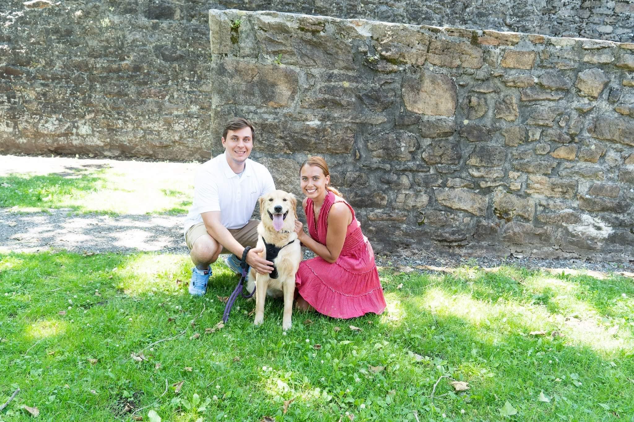 Austin and Alivia with their dog outdoors